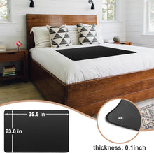 Earthing mat laid across a bed in a bright bedroom, showing its low-profile 0.1 in thickness