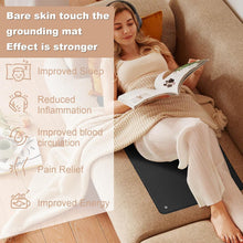 Woman relaxing on a couch with bare skin resting on the Earthlull grounding mat
