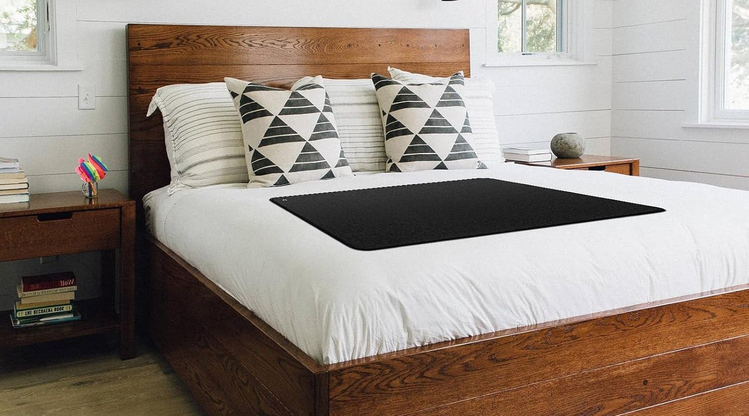 The Earthlull Mat laid across a bed